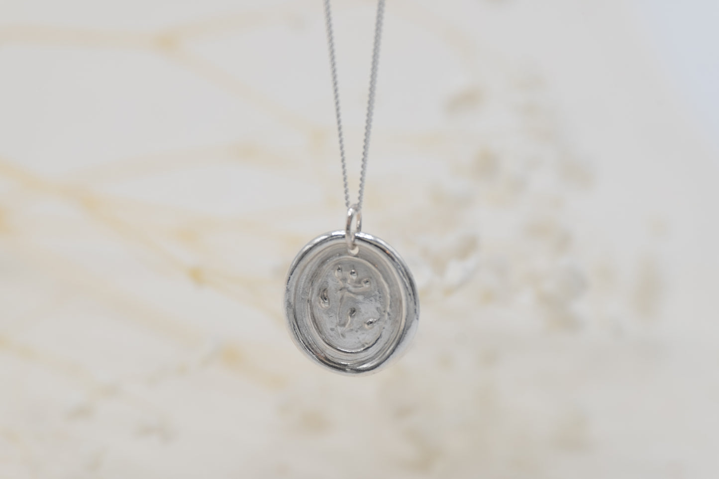 a floral wax seal necklace for women