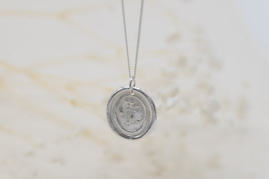 a floral wax seal necklace for women
