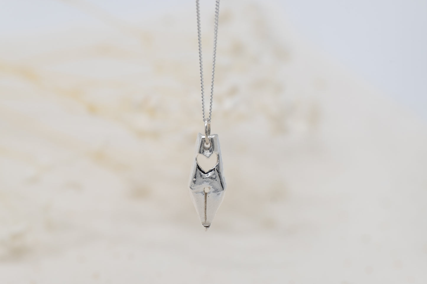 a silver pen nib necklace for writers