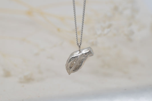 a writing hand necklace for women