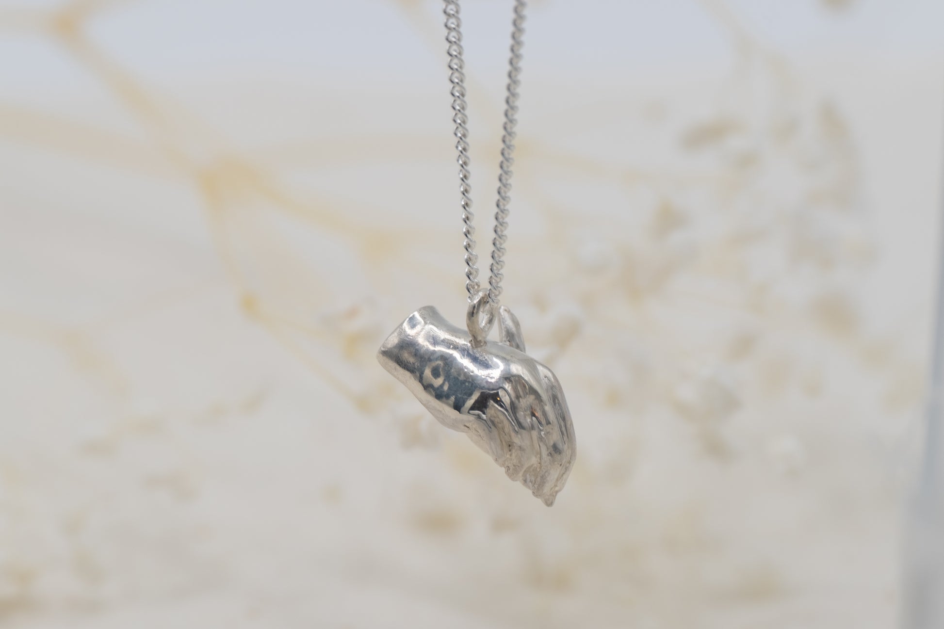 a hand writing necklace for writers